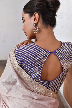Metallic Pink Tissue Saree paired with Printed Blouse.