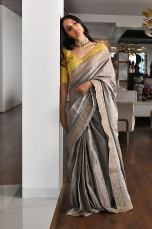 Gray color metallic linen saree with zari work