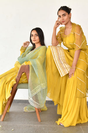 Yellow Georgette Spaghetti Kurta with Gharara and Jacket paired with Belt.